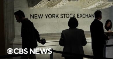 Stocks down as more companies announce layoffs