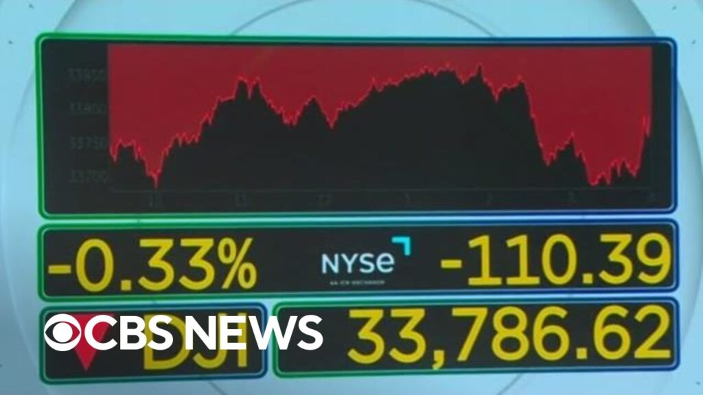 Stocks close slightly down as investors react to earnings reports